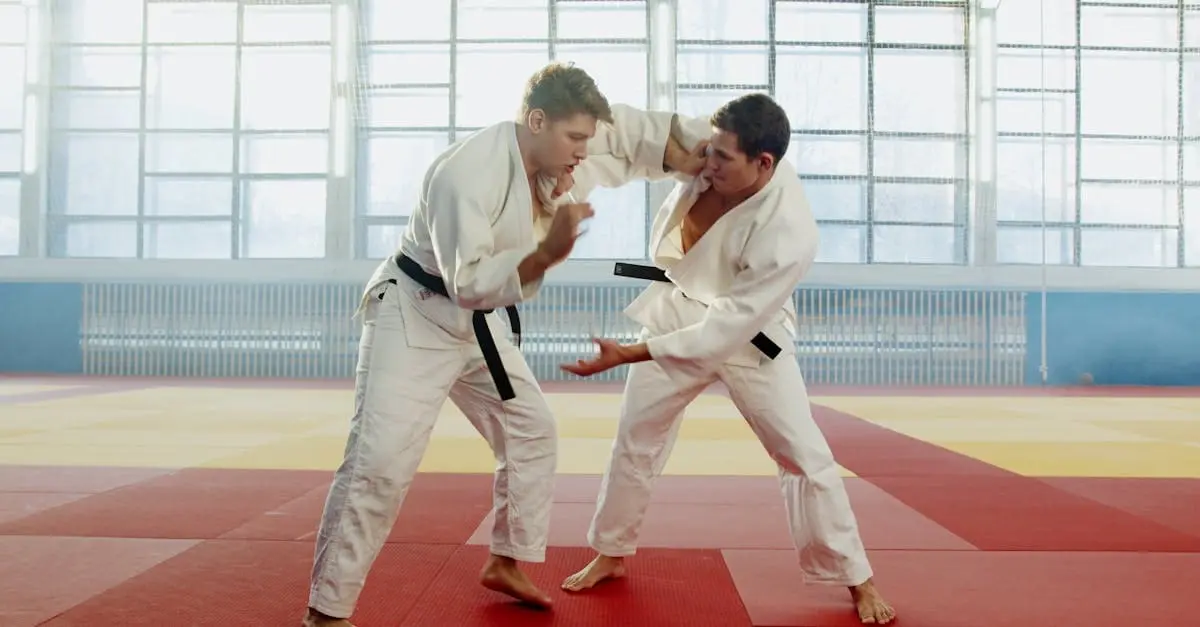 A focused middle-aged man in a white gi holding a defensive stance during a class featured on the adult martial arts training schedule.