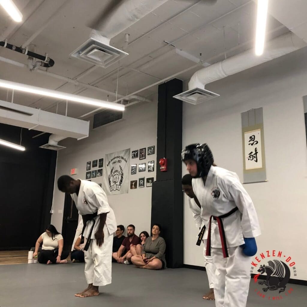Taekwondo students bow after beginner taekwondo drills during class practice